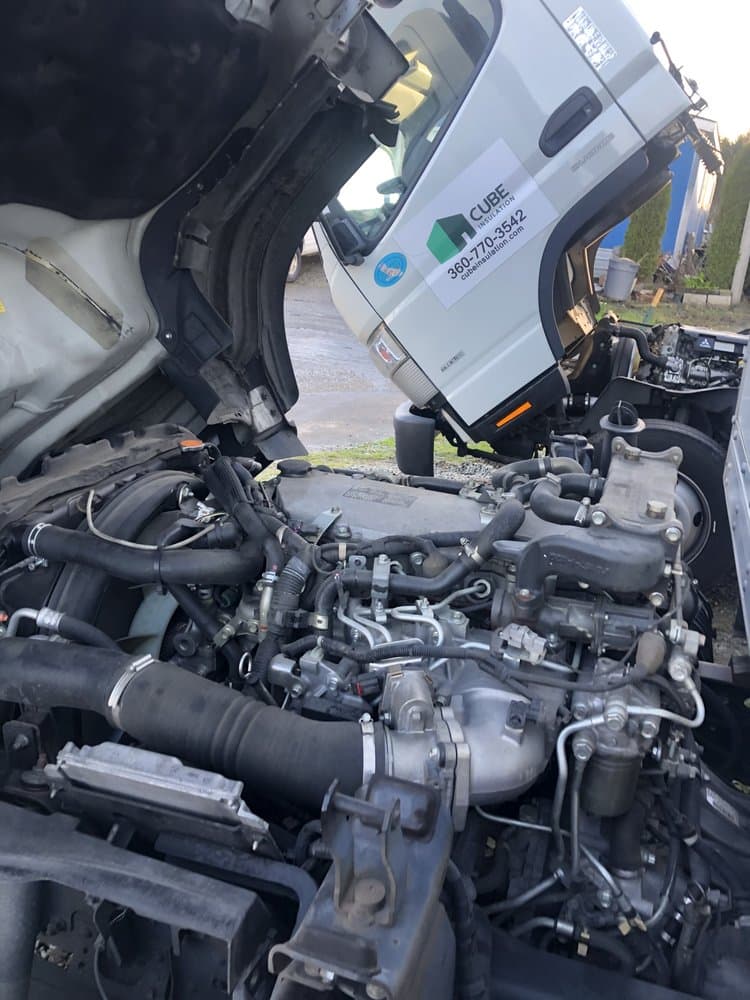 Cab-over commercial truck engine during diesel repair in Mount Vernon, WA