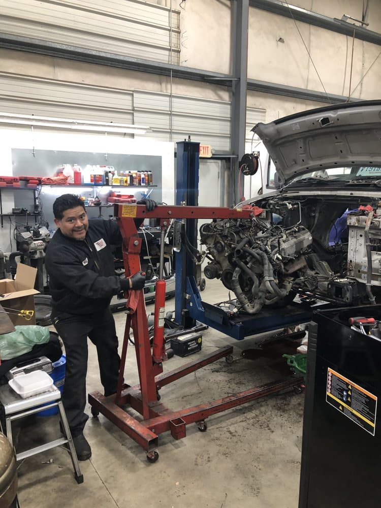 José Camacho working under the hood at his Mount Vernon auto repair shop