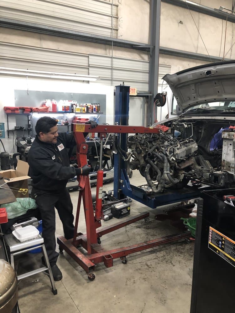 José Camacho working on a vehicle at American & Import Automotive in Mount Vernon, WA