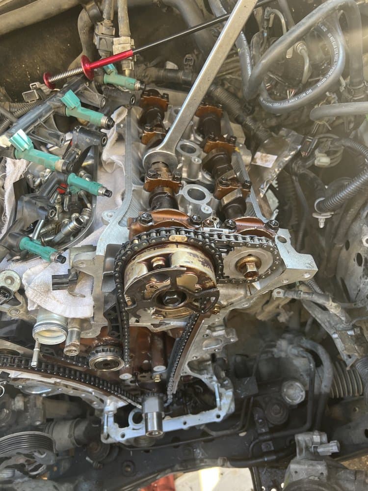 Timing chain exposed during engine repair at American & Import Automotive, Mount Vernon WA